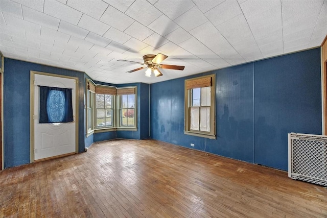 foyer entrance featuring a ceiling fan and hardwood / wood-style flooring