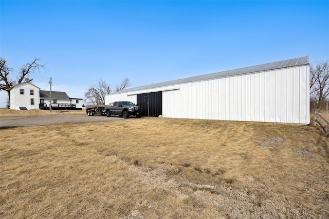 view of pole building with a yard