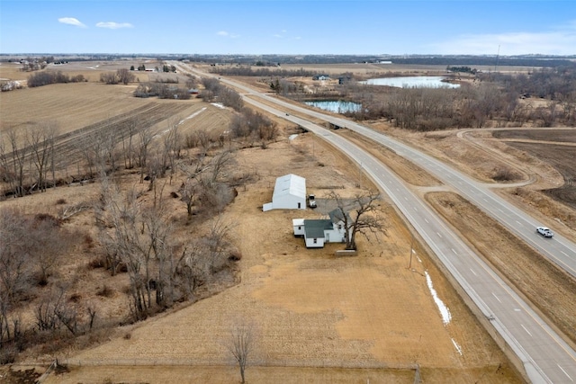 aerial view featuring a rural view and a water view