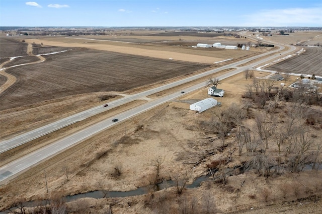 birds eye view of property with a rural view