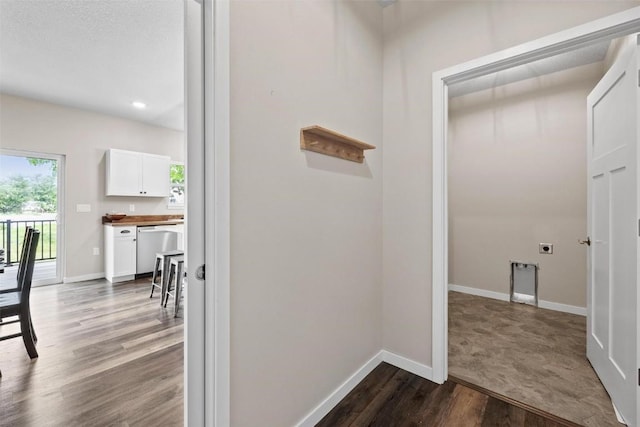 hallway with recessed lighting, dark wood-style floors, and baseboards