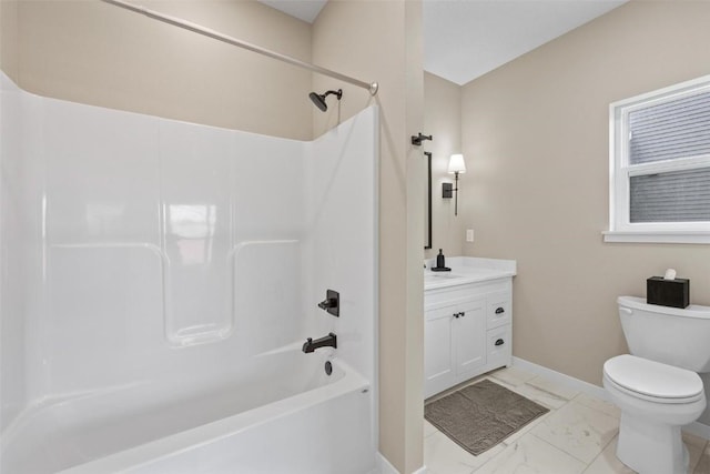 bathroom with baseboards, shower / washtub combination, toilet, marble finish floor, and vanity