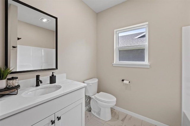 full bath with toilet, marble finish floor, baseboards, walk in shower, and vanity