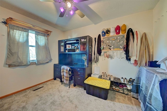 bedroom with visible vents, ceiling fan, baseboards, and carpet