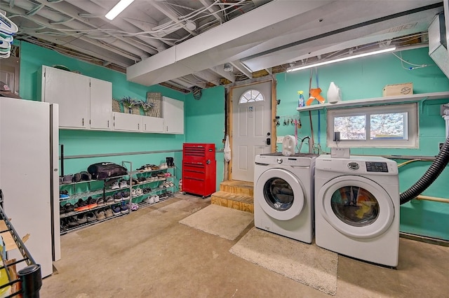 laundry area featuring cabinet space and washer and dryer