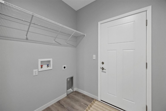 laundry room featuring baseboards, washer hookup, laundry area, wood finished floors, and electric dryer hookup