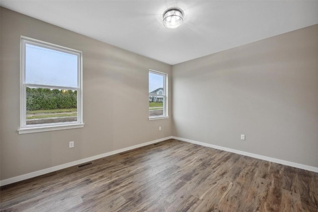 4193 Justified Dr, Marion, IA 52302 - unfurnished room featuring baseboards and wood finished floors