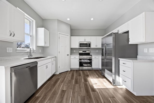 4209 Justified Dr, Marion, IA 52302 - kitchen with appliances with stainless steel finishes, a sink, white cabinetry, and recessed lighting
