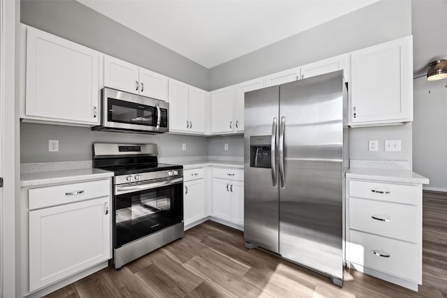4209 Justified Dr, Marion, IA 52302 - kitchen with stainless steel appliances, white cabinetry, and dark wood-style floors