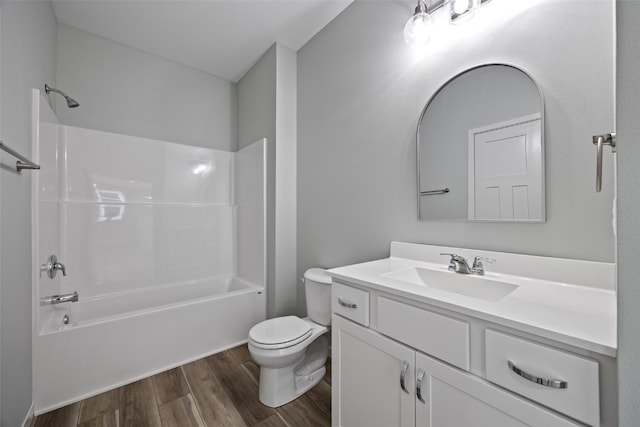 4209 Justified Dr, Marion, IA 52302 - full bathroom with vanity, wood finished floors, toilet, and  shower combination