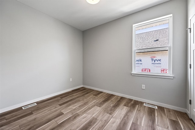4209 Justified Dr, Marion, IA 52302 - spare room with wood finished floors and baseboards