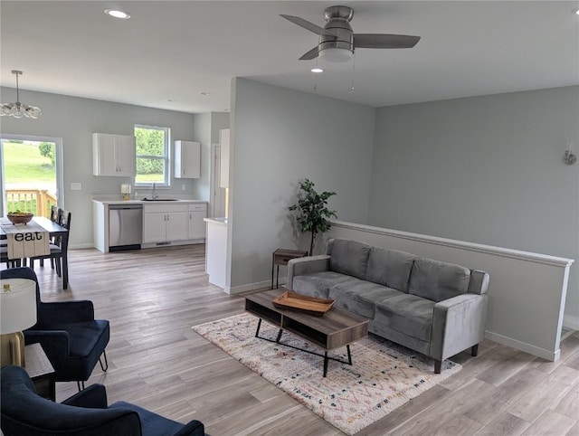 4209 Justified Dr, Marion, IA 52302 - living area with recessed lighting, baseboards, light wood finished floors, a ceiling fan, and a chandelier
