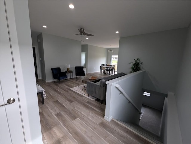4209 Justified Dr, Marion, IA 52302 - living area with recessed lighting, light wood-type flooring, a ceiling fan, and baseboards