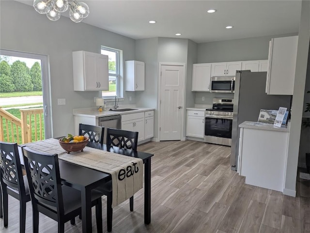 4209 Justified Dr, Marion, IA 52302 - dining space featuring a chandelier, light wood-type flooring, and recessed lighting