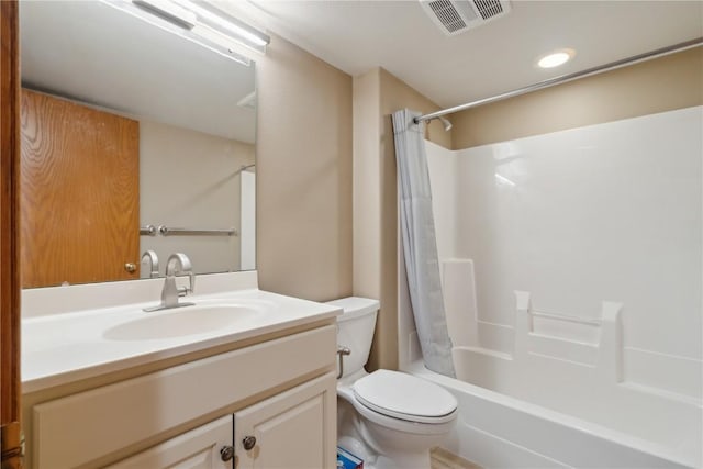 bathroom featuring shower / bath combo with shower curtain, visible vents, toilet, and vanity