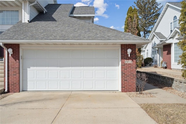 garage with concrete driveway