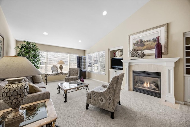 living area featuring a fireplace, lofted ceiling, recessed lighting, and carpet