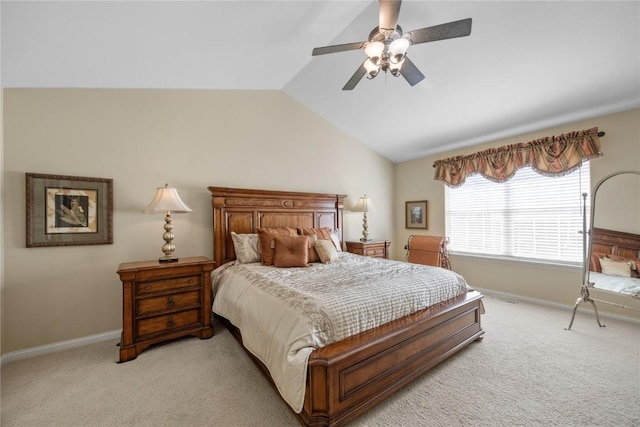 bedroom with light colored carpet, baseboards, and lofted ceiling