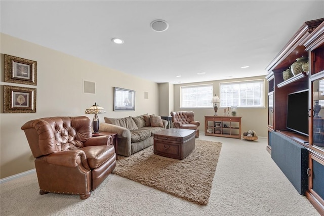 living area featuring visible vents, recessed lighting, baseboards, and carpet