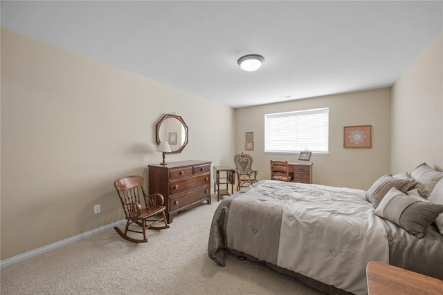 bedroom featuring baseboards and light carpet