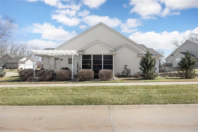 view of front of property with a front lawn and a pergola