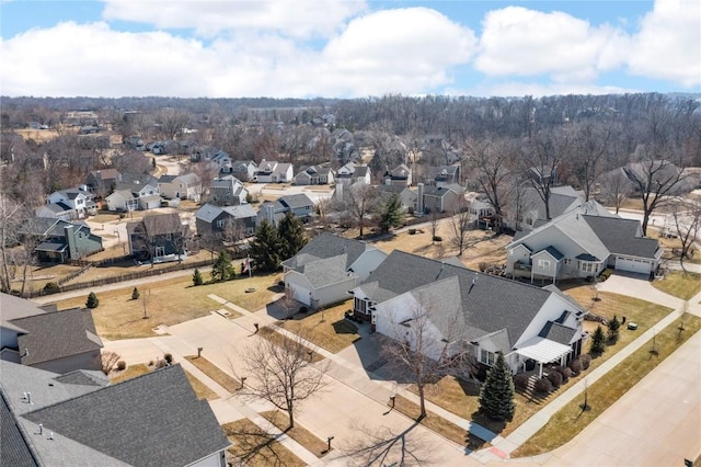 birds eye view of property with a residential view