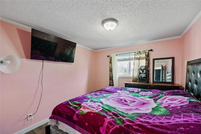 bedroom featuring a textured ceiling, baseboards, and ornamental molding