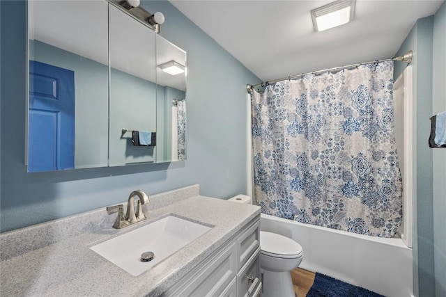 full bath with vanity, toilet, and shower / bath combo