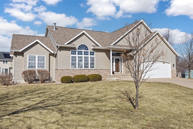 view of front of house with driveway, an attached garage, a shingled roof, a front lawn, and brick siding