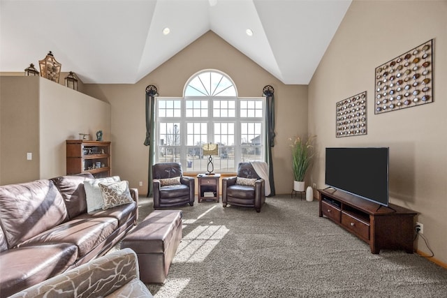 carpeted living room with recessed lighting and high vaulted ceiling