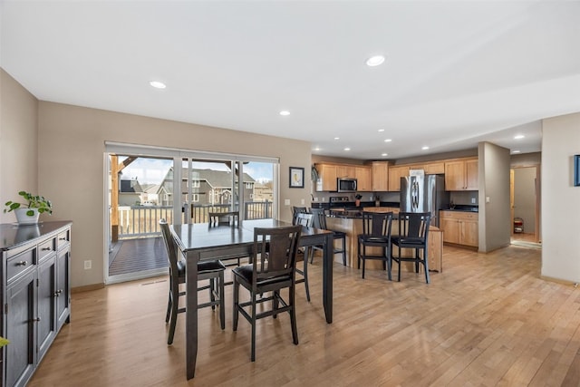 dining room featuring recessed lighting, light wood-type flooring, and baseboards