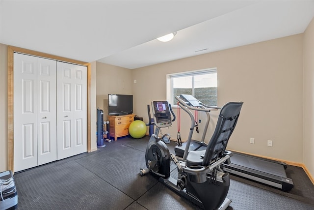 exercise area with baseboards