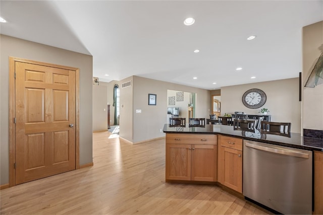 kitchen with visible vents, dark stone countertops, recessed lighting, light wood-style flooring, and stainless steel dishwasher