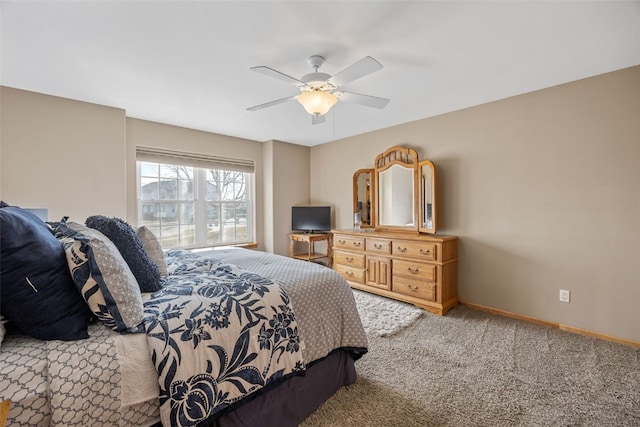 bedroom featuring baseboards, ceiling fan, and carpet flooring