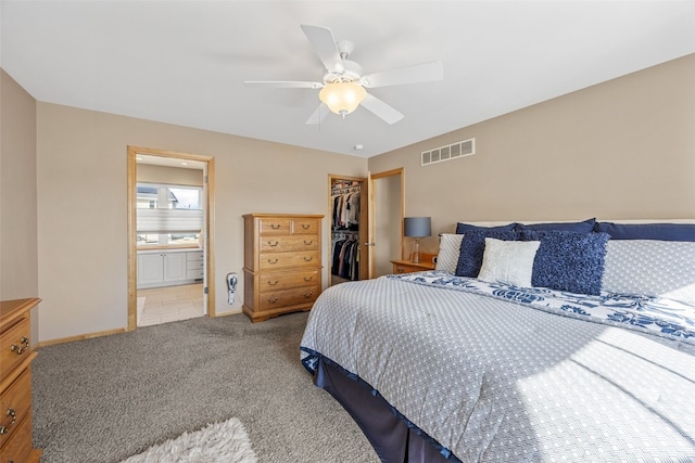 bedroom with visible vents, a closet, carpet, baseboards, and a spacious closet