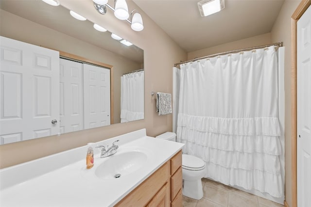 full bathroom with vanity, a shower with shower curtain, visible vents, tile patterned floors, and toilet