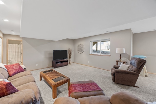 carpeted living room featuring recessed lighting and baseboards