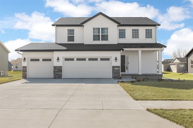 view of front of house with concrete driveway, a front yard, covered porch, a garage, and stone siding