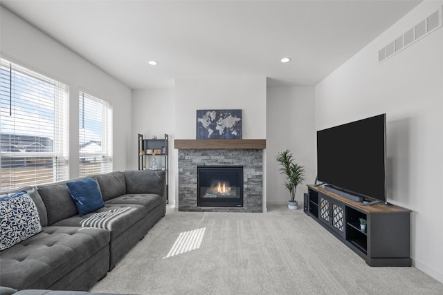 living area with recessed lighting, visible vents, baseboards, and carpet