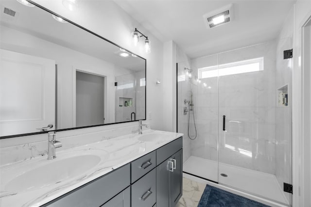 full bathroom with visible vents, marble finish floor, and a sink