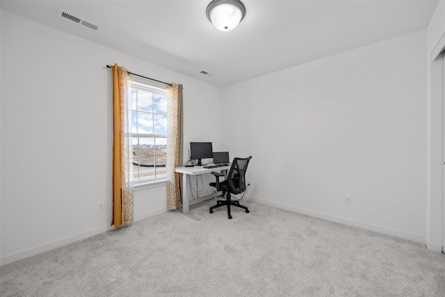 office featuring visible vents, baseboards, and carpet