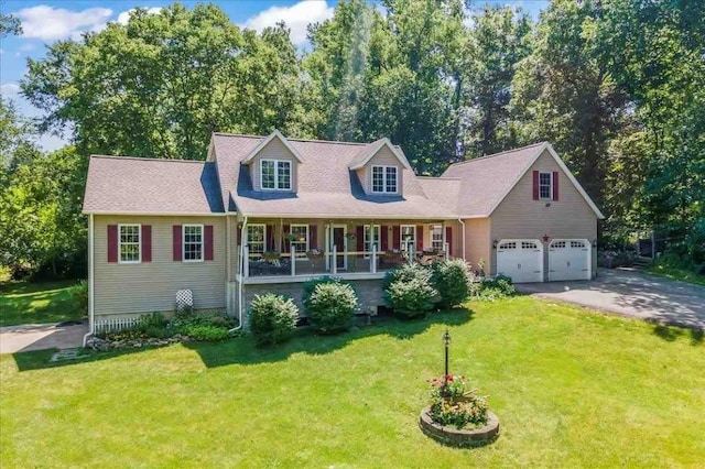 cape cod house with aphalt driveway, a garage, covered porch, and a front yard