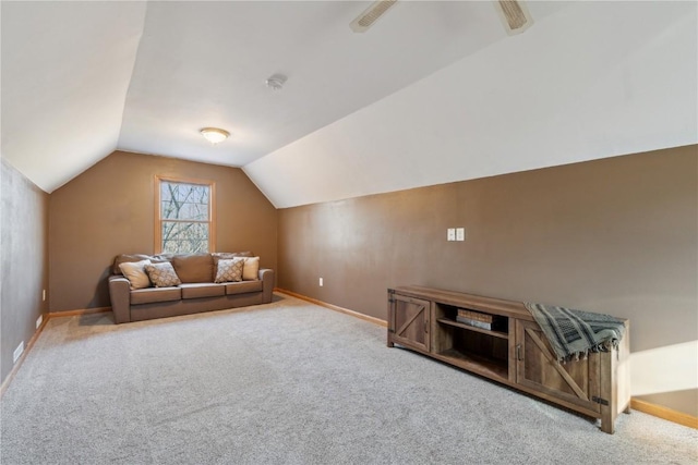 unfurnished living room with baseboards, lofted ceiling, and carpet floors