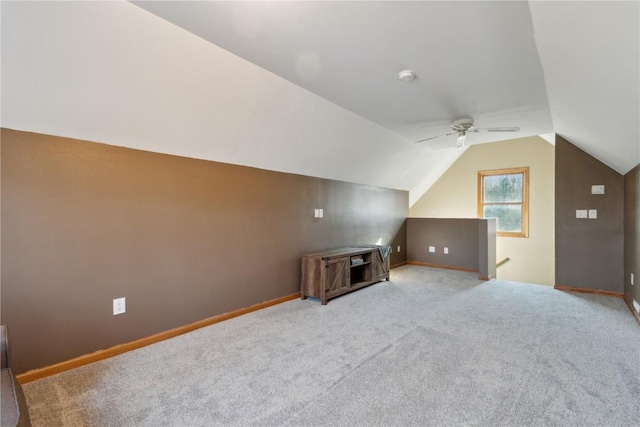 bonus room featuring ceiling fan, baseboards, lofted ceiling, and carpet floors