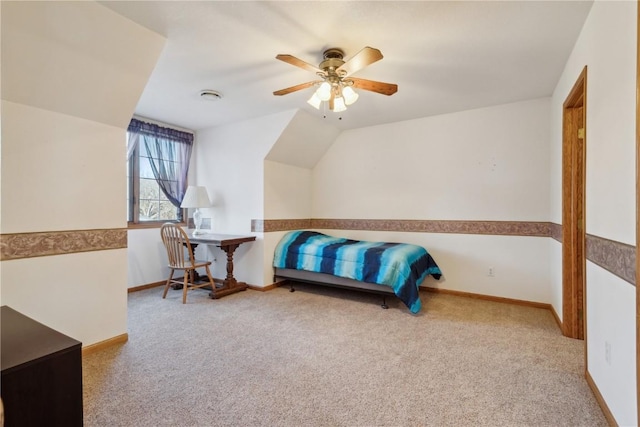 carpeted bedroom featuring baseboards, ceiling fan, and vaulted ceiling