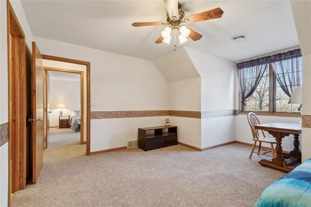 carpeted bedroom featuring visible vents, baseboards, and vaulted ceiling