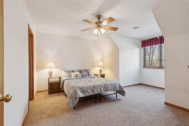 bedroom featuring light colored carpet, baseboards, and ceiling fan