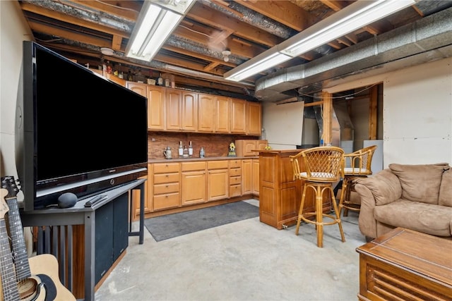 kitchen with unfinished concrete flooring and open floor plan