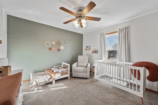 bedroom featuring baseboards, carpet floors, and ceiling fan