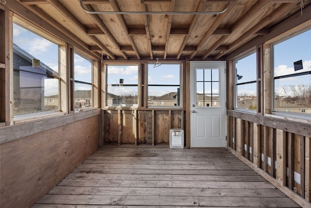 unfurnished sunroom featuring wood ceiling